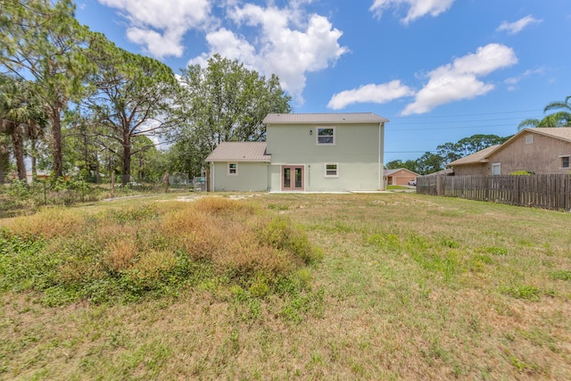 rear view of property featuring french doors