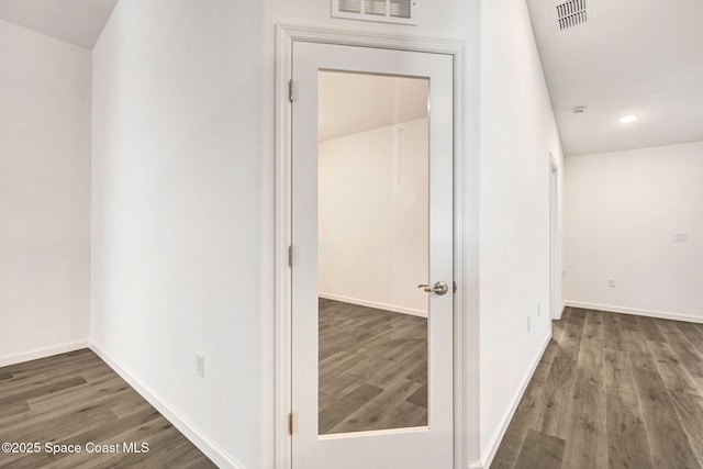 corridor featuring dark hardwood / wood-style flooring