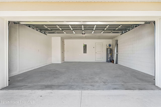 garage featuring electric water heater and electric panel