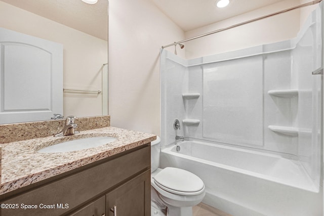 full bathroom featuring shower / bathing tub combination, vanity, and toilet