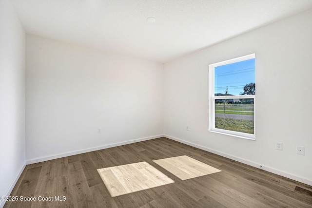 spare room featuring hardwood / wood-style flooring