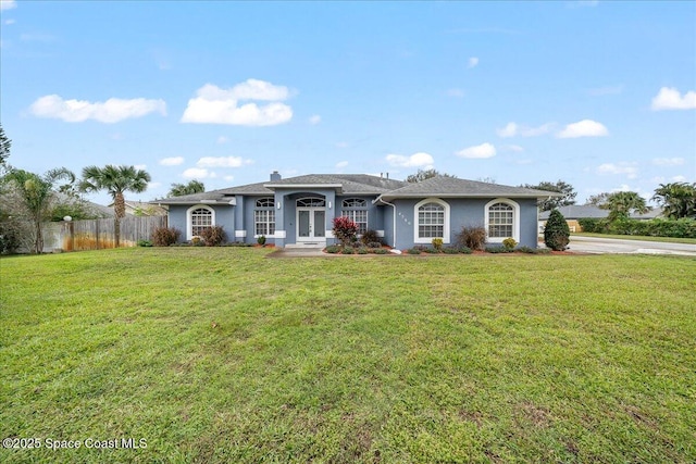 ranch-style house featuring a front yard