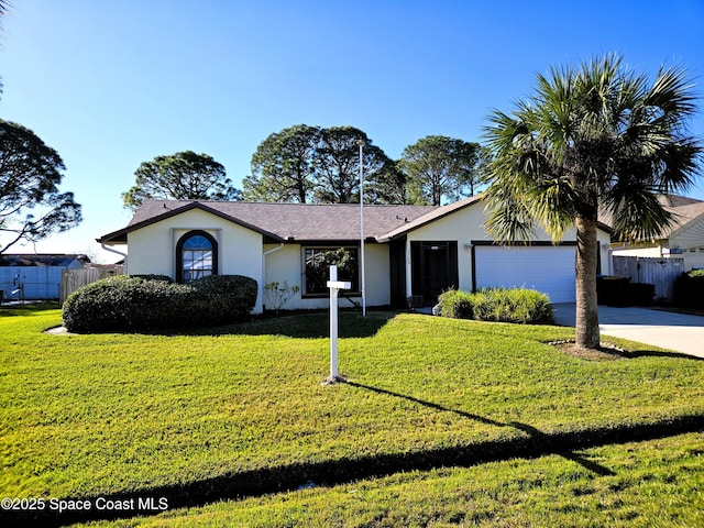 single story home featuring a garage and a front lawn