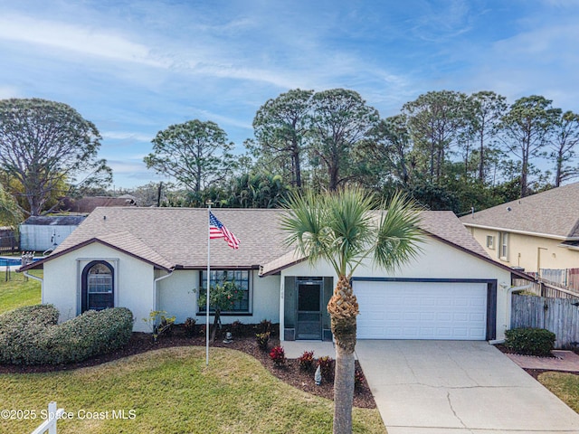 ranch-style home featuring a garage and a front lawn