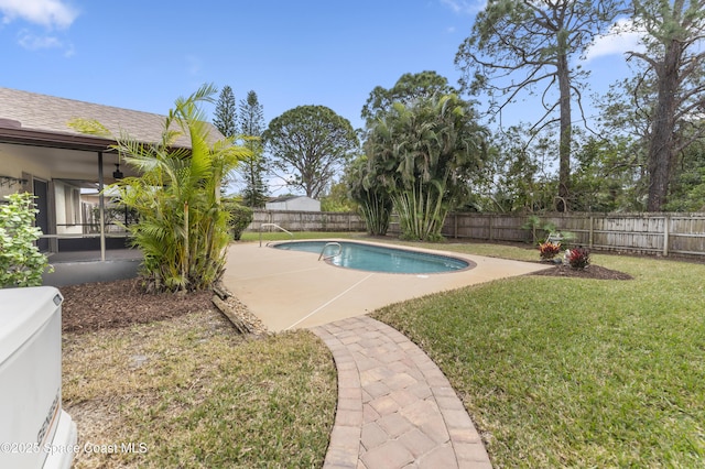 view of pool with a patio, a yard, and ceiling fan