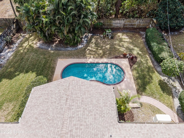 view of pool featuring a yard and a patio area