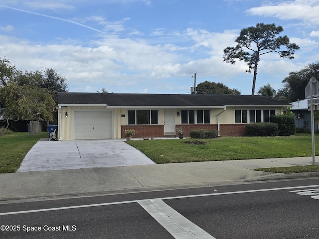 ranch-style home with a garage and a front lawn