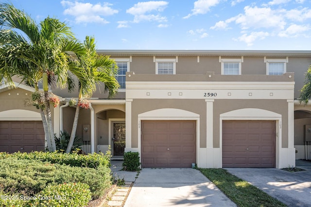 multi unit property featuring a garage