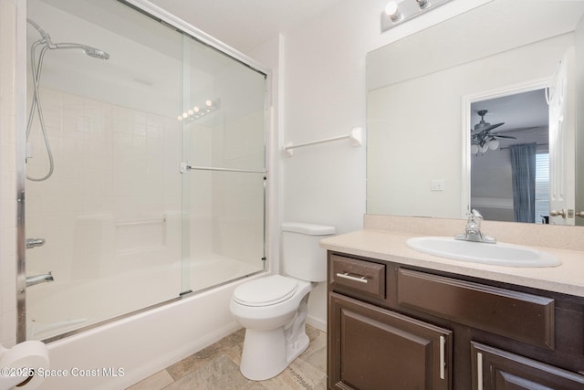 full bathroom featuring ceiling fan, toilet, enclosed tub / shower combo, and vanity