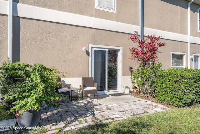 doorway to property featuring a patio area