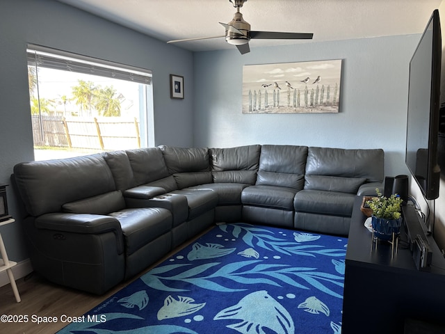 living room with hardwood / wood-style floors and ceiling fan