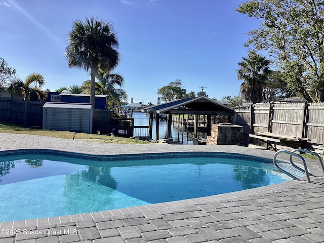 view of pool with a water view