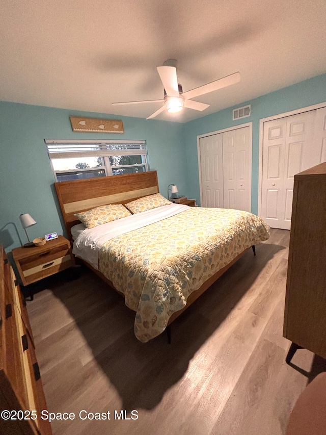 bedroom with hardwood / wood-style floors and ceiling fan