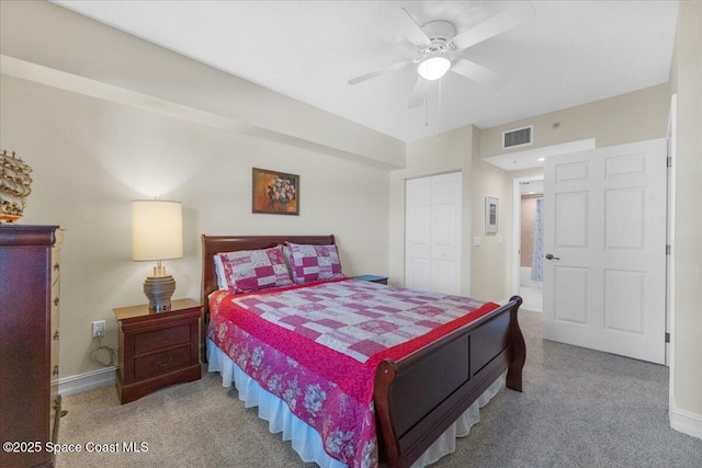 bedroom with carpet floors, ceiling fan, and a closet