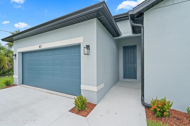 doorway to property featuring a garage