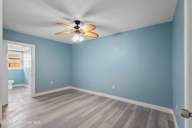 empty room featuring light hardwood / wood-style floors and ceiling fan