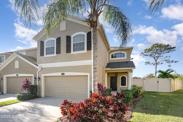 view of front facade with a front yard and a garage