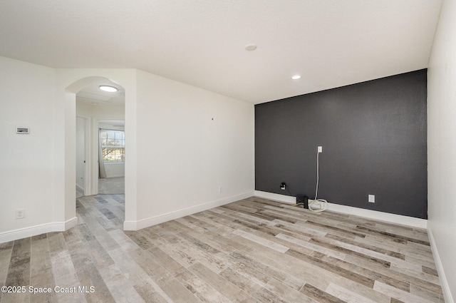 unfurnished room featuring light hardwood / wood-style flooring