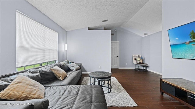 living room with a textured ceiling, dark hardwood / wood-style flooring, and vaulted ceiling