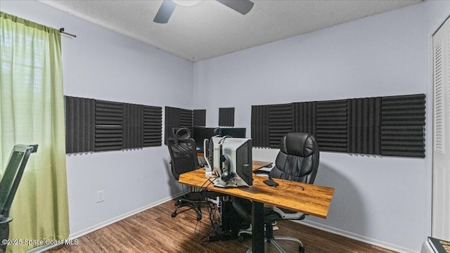 office area featuring wood-type flooring, a textured ceiling, and ceiling fan