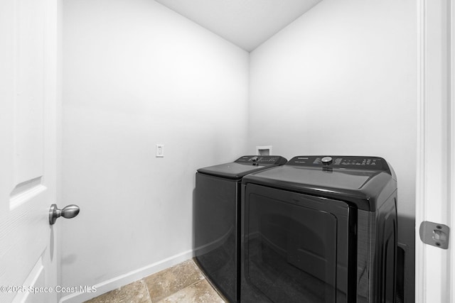 clothes washing area featuring washing machine and dryer