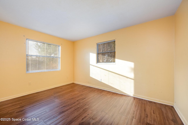 spare room featuring hardwood / wood-style flooring