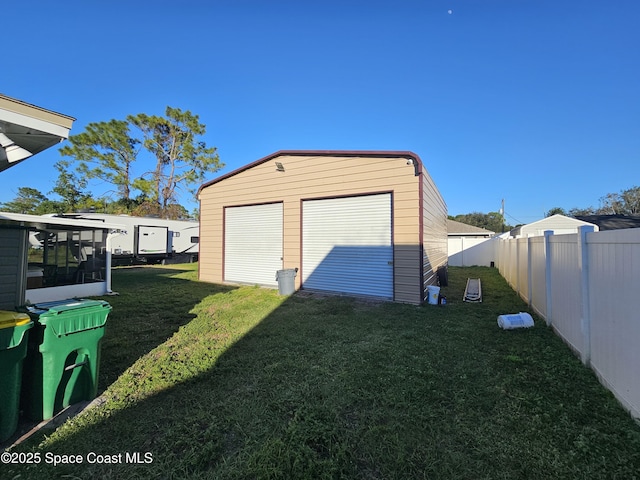 garage with a yard