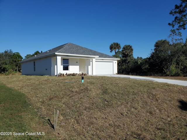 ranch-style home featuring a garage and a front lawn