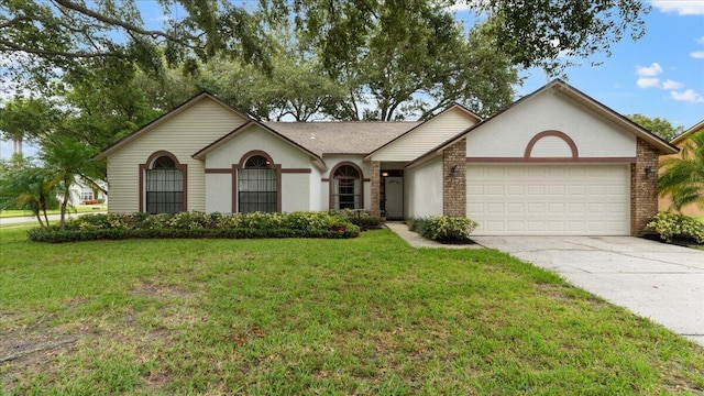 ranch-style house featuring a front yard and a garage