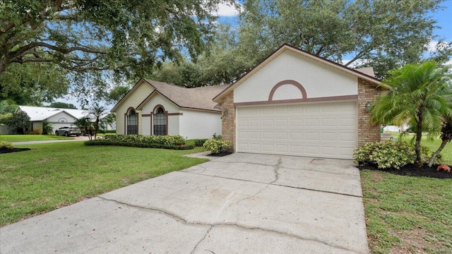 view of front of house with a garage and a front lawn