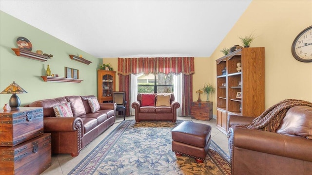 living room with tile patterned flooring and lofted ceiling