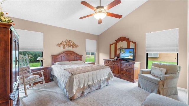 carpeted bedroom featuring high vaulted ceiling and ceiling fan