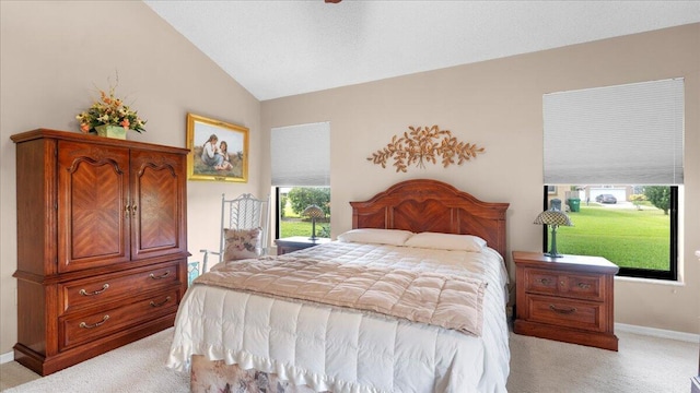 bedroom featuring light carpet and lofted ceiling