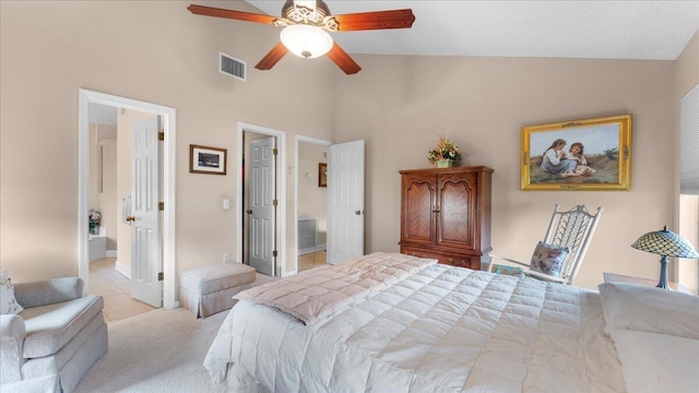 bedroom featuring connected bathroom, ceiling fan, and lofted ceiling