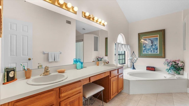 bathroom featuring tile patterned floors, a relaxing tiled tub, vanity, and vaulted ceiling