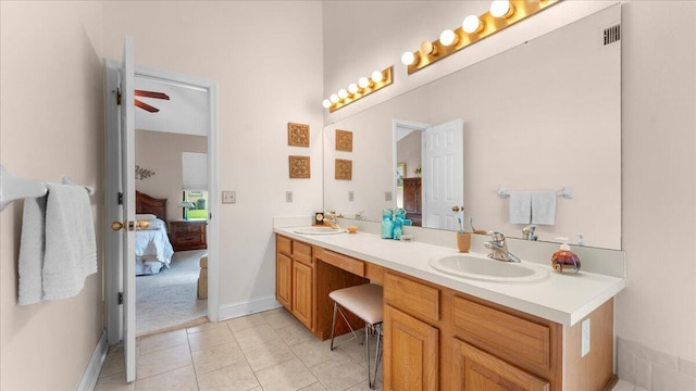 bathroom with tile patterned flooring, ceiling fan, and vanity