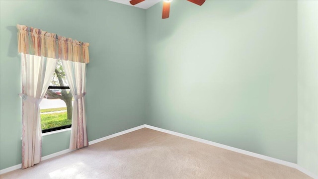 carpeted empty room with ceiling fan