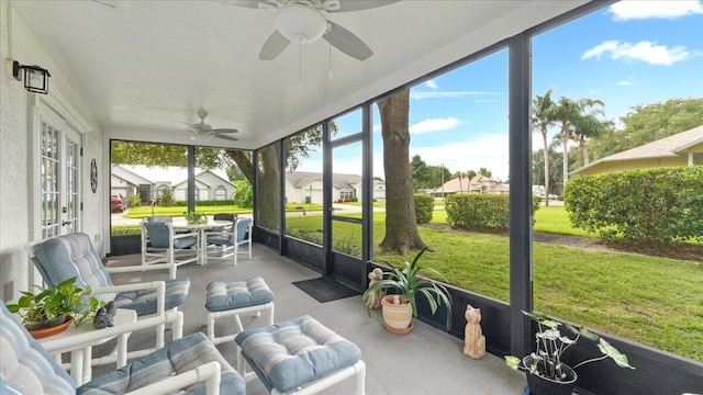 sunroom / solarium with ceiling fan