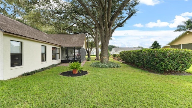 view of yard featuring a sunroom