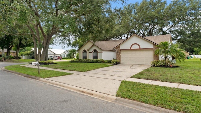 view of front of house featuring a front lawn and a garage