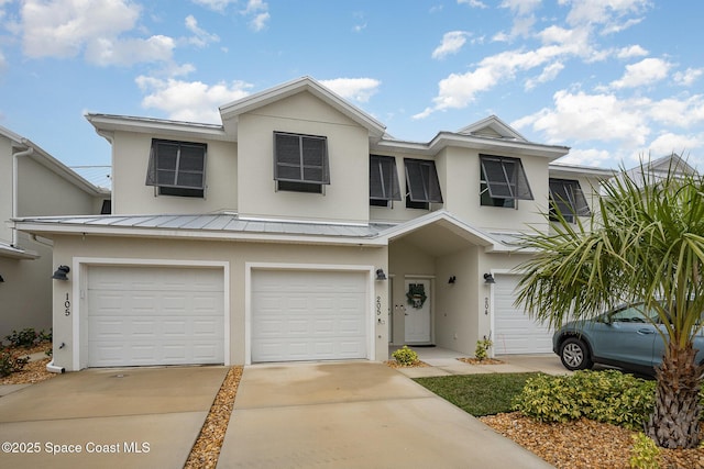 multi unit property featuring a garage