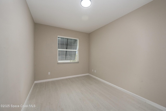 spare room featuring light hardwood / wood-style flooring