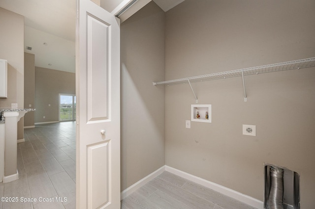 washroom with electric dryer hookup and hookup for a washing machine