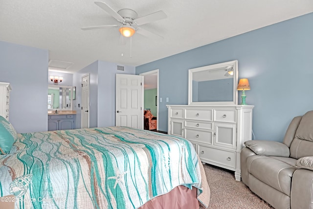 carpeted bedroom featuring connected bathroom and ceiling fan