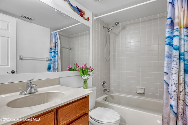 full bathroom with shower / bath combo with shower curtain, vanity, and toilet