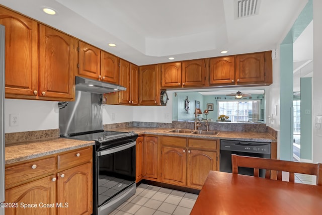 kitchen featuring ceiling fan, sink, a raised ceiling, light tile patterned floors, and black appliances