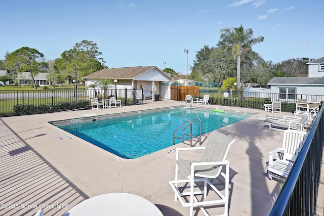 view of swimming pool featuring a patio area