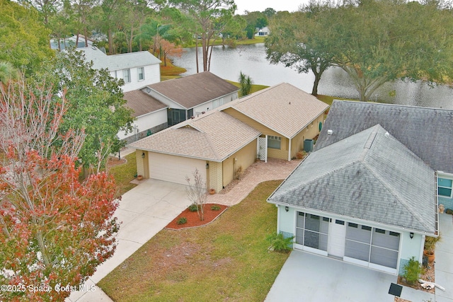 birds eye view of property featuring a water view