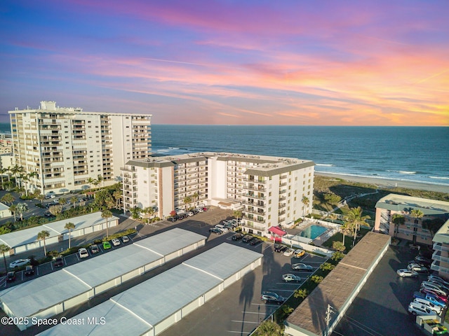 aerial view featuring a water view and a beach view