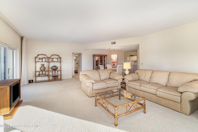 carpeted living area featuring visible vents